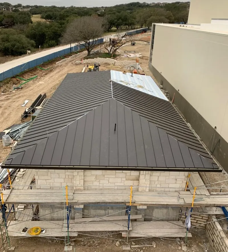 Metal roof new construction with scaffolding in Independence